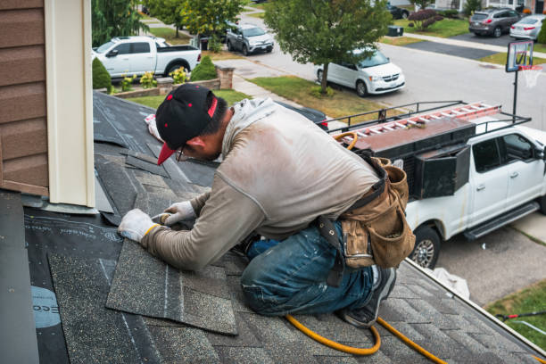 Professional Gutter Installation technician working in Huntingdon, TN